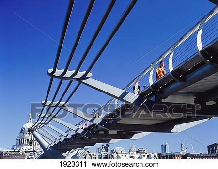 Stock Image - People Walking Over Millenium Bridge. Fotosearch