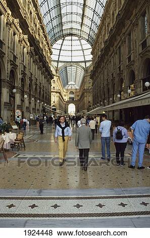 Stock Photo - People Walking Through Arcade. Fotosearch