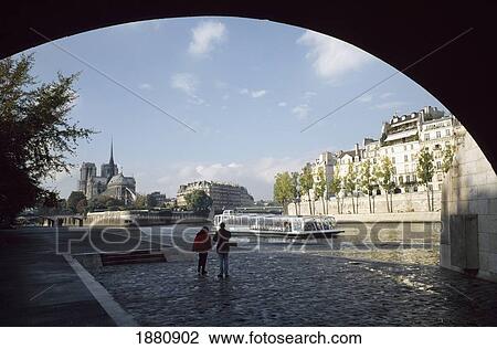 People Walking Under Bridge Near Notre Dame And River Seine View Large Photo Image Stock Image - People Walking Under Bridge Near Notre Dame And River Seine. Fotosearch