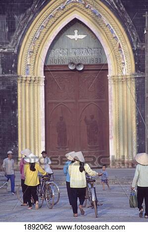 Stock Image - People With Bicycles In Front Of Church Entrance. Fotosearch