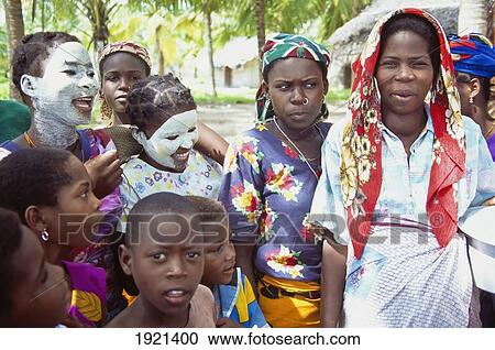 Stock Image - People With Faces Painted White. Fotosearch