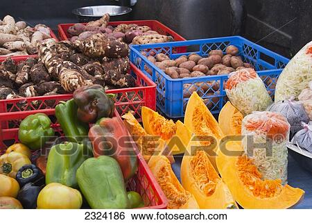 Stock Photograph - Peppers, squash, potatoes, tubers, cabbage for sale on back of pick-up truck; Easter Island, Chile. Fotosearch