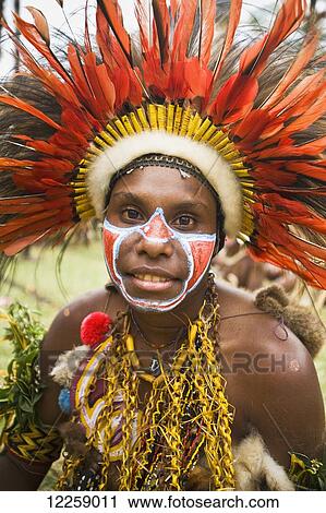 Stock Image - Performer wearing traditional costume at the Gokoka Show; Eastern Highlands, Papua New Guinea. Fotosearch