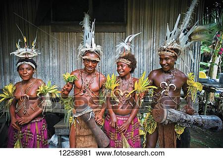 Stock Image - Performers at the Bil bil pottery village, near Madang; Madang Province, Papua New Guinea. Fotosearch