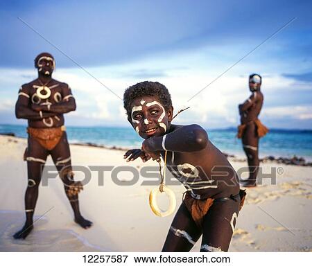 Stock Photo - Performers wearing the traditional dress of the Solomon Islands; Western Province, Solomon Islands. Fotosearch
