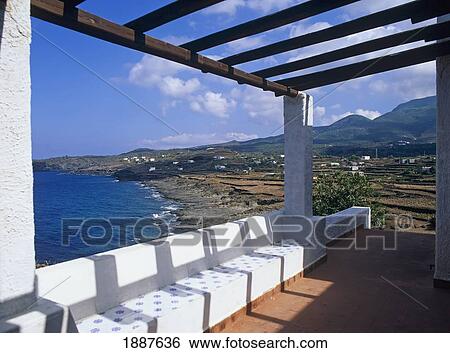 Stock Photograph - Pergola Over Patio By Coastline. Fotosearch