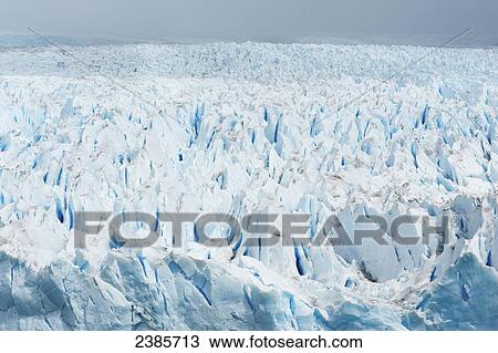 Stock Image - Perito Moreno Glacier between the mountains in Los Glaciares National Park; El Calafate, Santa Cruz, Argentina. Fotosearch