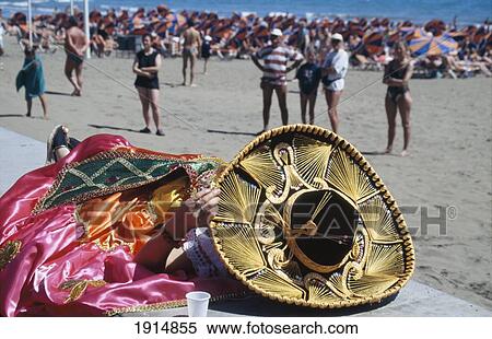 Stock Photography - Person Asleep In Sombrero At Carnival. Fotosearch