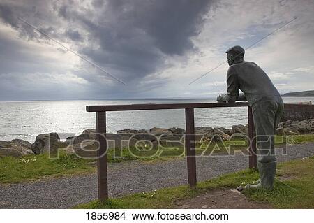 Picture - Person Enjoying Coastal View, Port William, Dumfries And Galloway, Scotland. Fotosearch