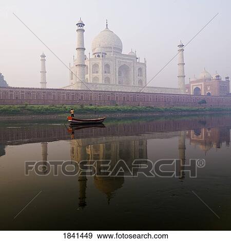 Stock Photo - Person In Boat In Front Of Taj Mahal; Agra, India. Fotosearch
