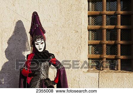 Stock Photo - Person in Venetian costume during Venice Carnival; Venice, Italy. Fotosearch