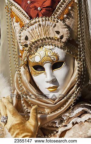 Stock Photo - Person in Venetian costume during Venice Carnival; Venice, Italy. Fotosearch