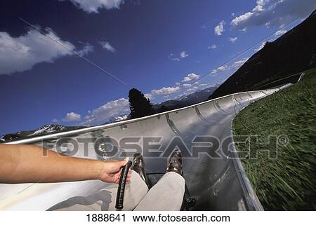 Stock Image - Person On Dry Toboggan Run. Fotosearch
