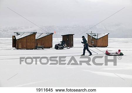 Person Pulling Child In Sled By Abisko Ark Hotel Cabins, Abisko, Sweden View Large Photo Image Stock Photography - Person Pulling Child In Sled By Abisko Ark Hotel Cabins, Abisko, Sweden. Fotosearch