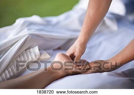 Stock Image - Person Receiving Massage; Fairmont Kea Lani, Outdoor Gazebo Spa, Wailea, Maui, Hawaii, Usa. Fotosearch