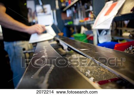 Picture - Person Waxing Skis. Fotosearch