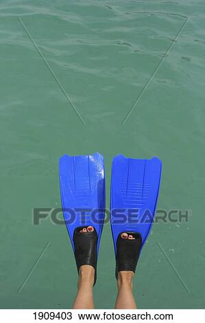 Stock Image - Person Wearing Flippers Over Sea, Low Section, Mayan Riviera, Yucatan Peninsular, Quintana Roo State, Mexico. Fotosearch
