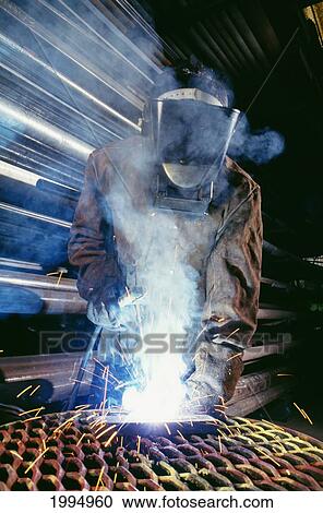 Person Welding With Mask And Suit View Large Photo Image Stock Image - Person Welding With Mask And Suit. Fotosearch