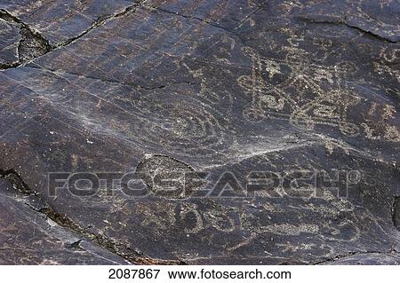 Stock Photo - Petroglyphs On A Boulder Show Buddhist Symbols, Shatial Near Chilas, Northern Areas, Pakistan. Fotosearch