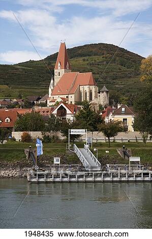 Stock Photography - Pfrarrkirche (Church) in Weissenkirchen, as seen from the Danube River in Wachau, Lower Austria, Austria. Fotosearch