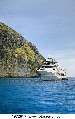 Stock Photo - Philippines, Cuyo Archipelago, Quiminatin Island, Dive Boat Cruising In Blue Ocean Water.. Fotosearch