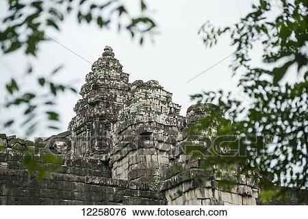 Stock Photograph - Phnom Bakheng, ancient buddhist temple from the famous Angkor area; Siem Reap, Cambodia. Fotosearch