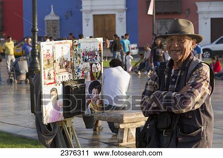 Stock Image - Photographer on the Plaza Mayor, Trujillo, Peru. Fotosearch