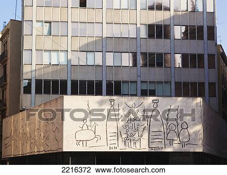 Stock Image - Picasso Designed Frieze Produced By Artist Carl Nesjar On The Facade Of Barcelona College Of Architects In Placa Nova; Barcelona Spain. Fotosearch