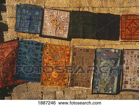 Stock Photograph - Pieces Of Fabric Hanging In Market, Close Up. Fotosearch