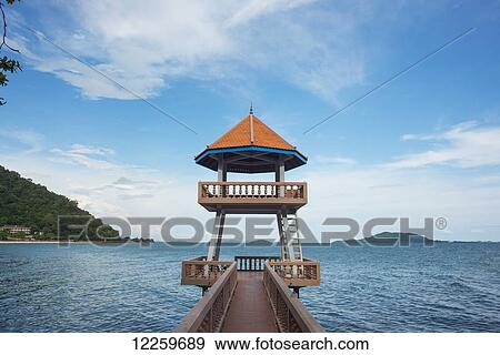 Stock Photo - Pier and covered upper platform on Kep's seaside; Kep, Cambodia. Fotosearch