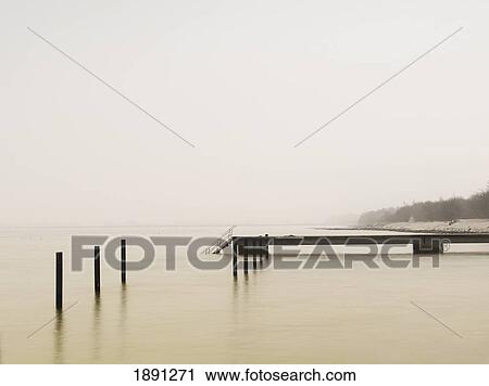 Pier On Misty Lake At Dawn View Large Photo Image Stock Image - Pier On Misty Lake At Dawn. Fotosearch