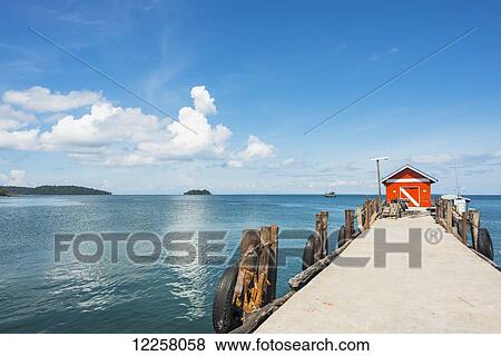 Stock Photo - Pier with small red building at the end, Gulf of Thailand; Koh Rong Island, Cambodia. Fotosearch