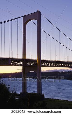 Pierre Laporte Bridge Over Saint Lawrence River At Dusk; Quebec Canada View Large Photo Image Stock Image - Pierre Laporte Bridge Over Saint Lawrence River At Dusk; Quebec Canada. Fotosearch