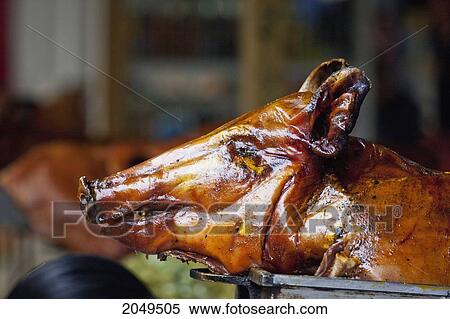 Stock Photography - Pig Head For Sale At The Saturday Market, Otavalo, Imbabura, Ecuador. Fotosearch
