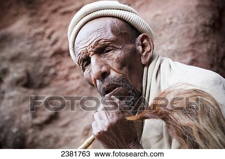 Stock Image - Pilgrim at the Orthodox Easter celebrations; Lalibela, Ethiopia. Fotosearch