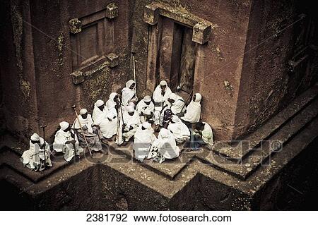 Stock Image - Pilgrims at the preserved rock-hewn Church of Saint George, or Bete Giyorgis; Lalibela, Ethiopia. Fotosearch
