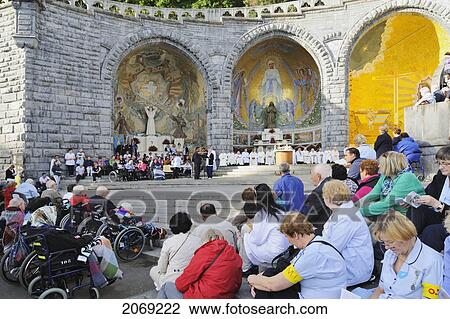 Pilgrims Gather At The Sanctuary Of Our Lady Of Lourdes; Lourdes Hautes-Pyrenees France View Large Photo Image Stock Image - Pilgrims Gather At The Sanctuary Of Our Lady Of Lourdes; Lourdes Hautes-Pyrenees France. Fotosearch