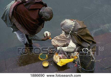 Pilgrims Preparing For An Offering At The Ganges, High Angle View View Large Photo Image Stock Image - Pilgrims Preparing For An Offering At The Ganges, High Angle View. Fotosearch