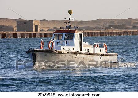 Pilot Boat In The Suez Canal, Suez, South Sinai, Egypt View Large Photo Image Stock Photo - Pilot Boat In The Suez Canal, Suez, South Sinai, Egypt. Fotosearch