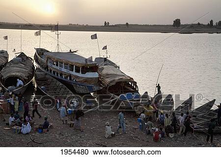 Stock Image - Pinasse Boats on the Niger River in Mopti, Mali. Fotosearch