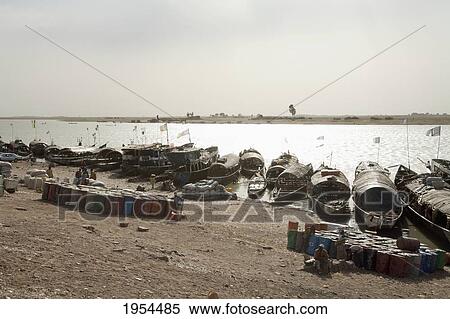 Pinasse boats on the Niger River in Mopti, Mali View Large Photo Image Stock Photography - Pinasse boats on the Niger River in Mopti, Mali. Fotosearch