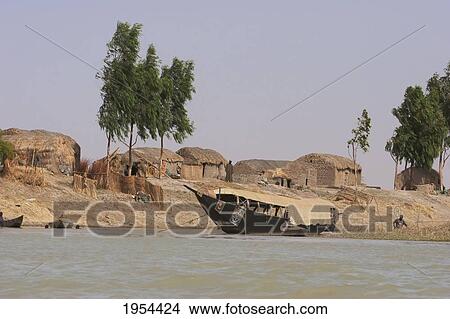 Picture - Pinasse carrying cargo and passengers on the Niger River between Mopti and Lake D? bo, Mali. Fotosearch