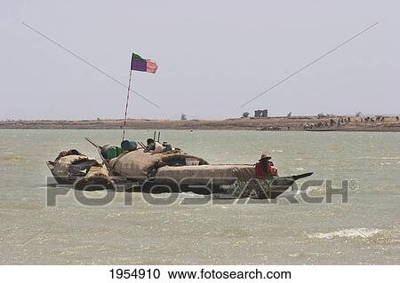 Stock Image - Pinasse carrying cargo and passengers on the Niger River between Mopti and Lake Debo, Mali. Fotosearch