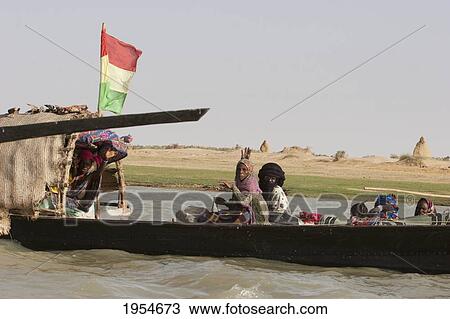 Stock Image - Pinasse carrying cargo and people on the Niger River between Niafunke and Kabara, Mali. Fotosearch