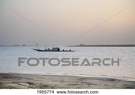 Picture - Pinasse In The Sunset On The Niger River Between Niafunke And Kabara, Mali. Fotosearch