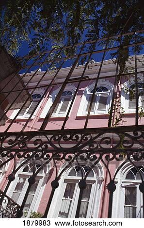 Stock Image - Pink Colonial House. Fotosearch
