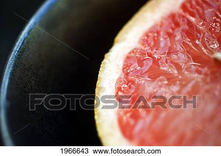 Stock Image - Pink Grapefruit Half, Fresh Cut, Selective Focus.. Fotosearch