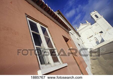 Pink House And Whitewashed Village Church View Large Photo Image Stock Photo - Pink House And Whitewashed Village Church. Fotosearch