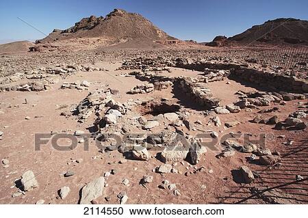Stock Image - Pits For Storage On An Arid Landscape; Timna Park Arabah Israel. Fotosearch