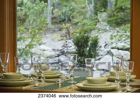 Stock Photograph - Place Setting In Home With Mountain View; Whistler, British Columbia, Canada. Fotosearch